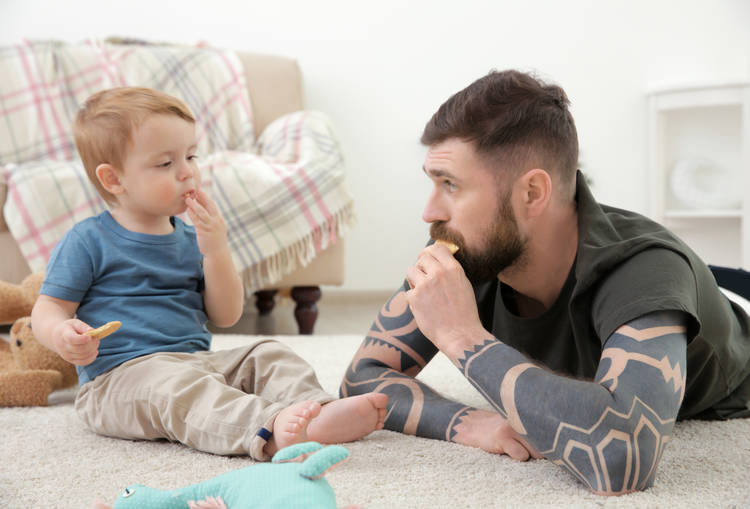 Man on floor with toddler