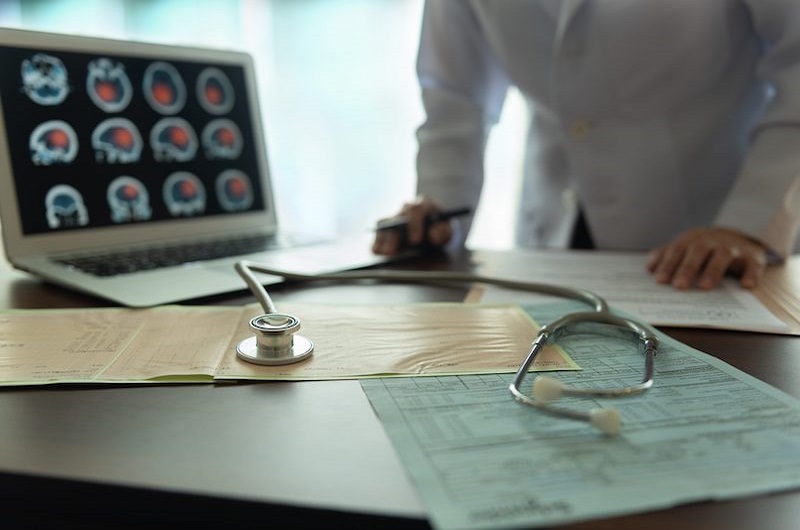 doctor looking over scans