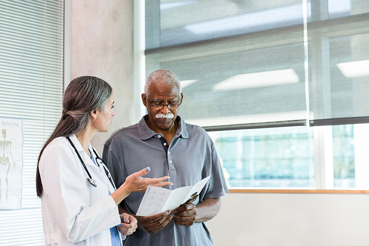 Man talking with female doctor