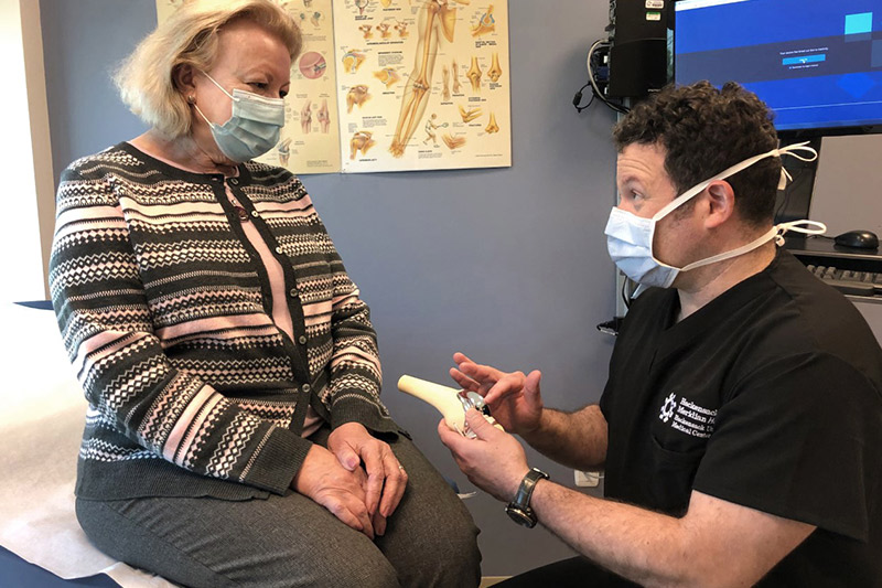 Woman discussing her care with her provider.