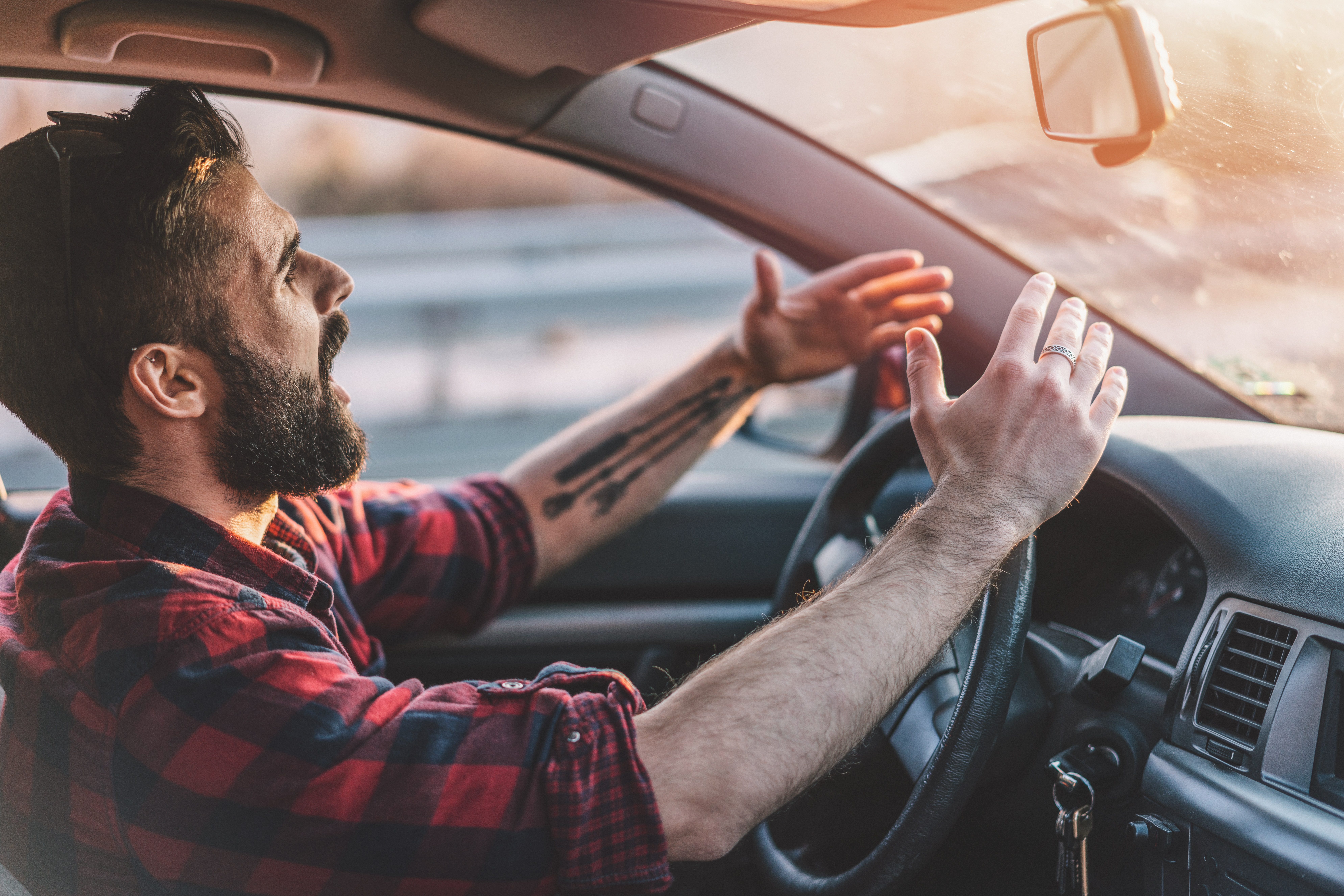 man angry driving car