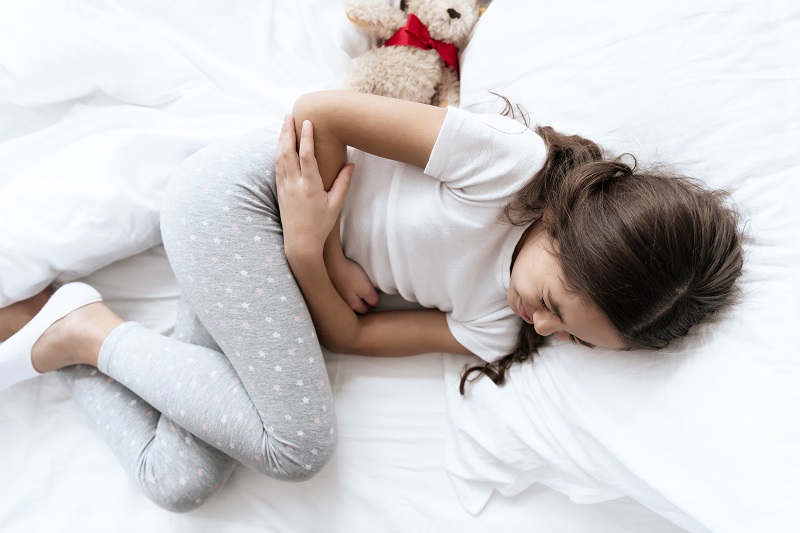 Young girl with stomach issues and pain