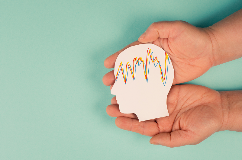 Holding a head in the hands, mental health concept for epilepsy, electrical current on head