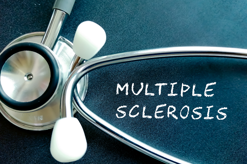 Multiple Sclerosis written on a chalk board with a stethoscope next to it, symbolizing diagnosis