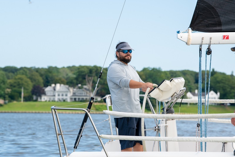 Rick Kolber captaining a boat out on the water.
