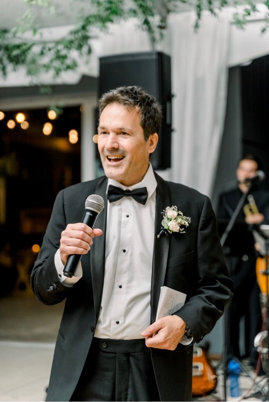 Don giving a speech at his daughter's wedding.