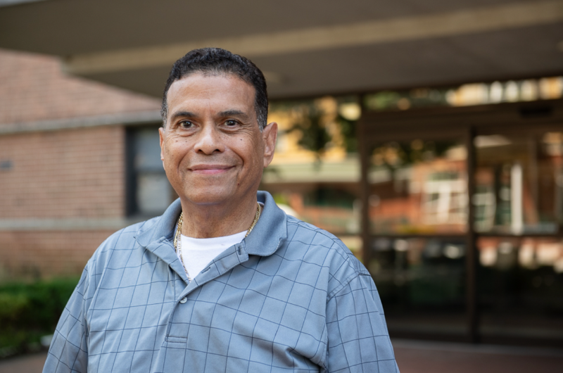 Stroke rehabilitation patient Luis Villa smiles at the camera.