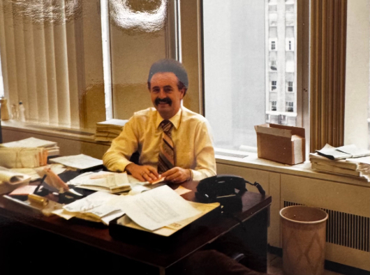 Nick sitting at his desk, in his office in Manhattan.