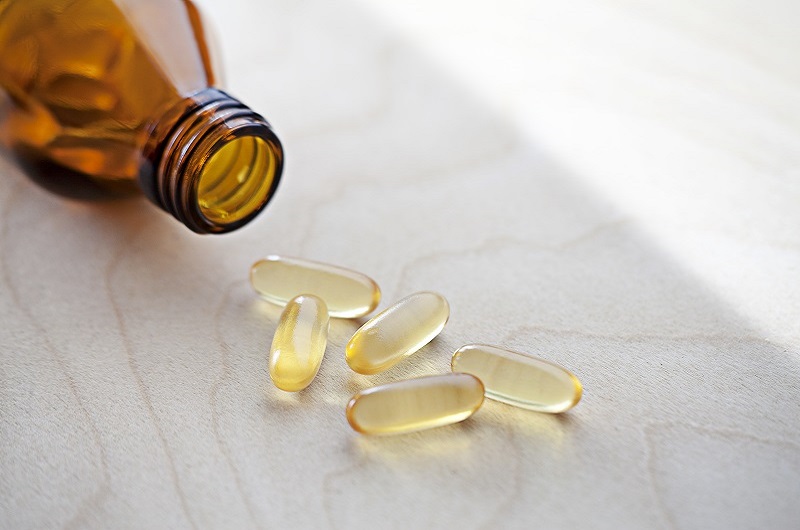 Vitamins spilled out on a counter, vitamin B12