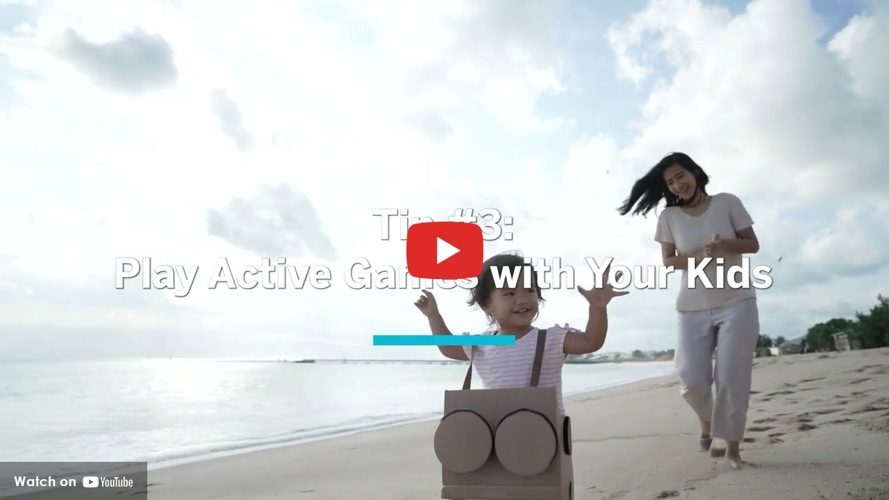 Parent and child playing together on the beach