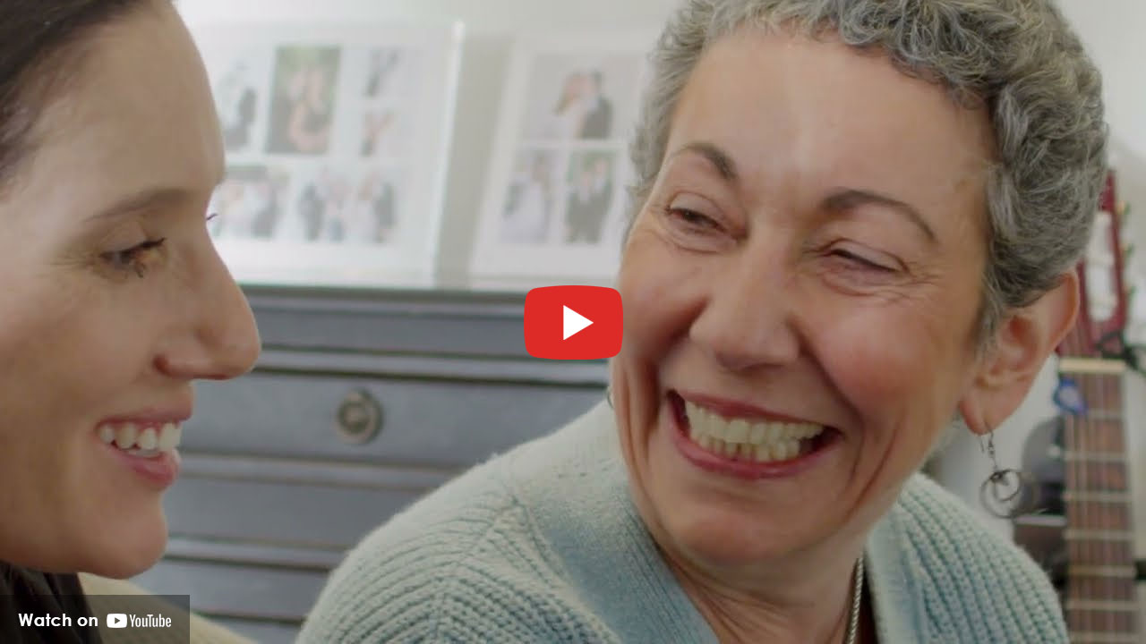 Two women smiling and talking together