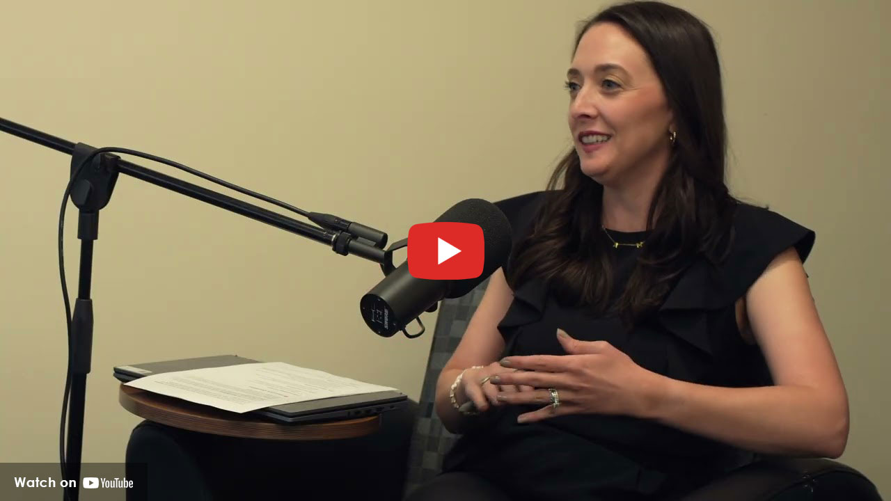 Woman speaking into microphone during health discussion