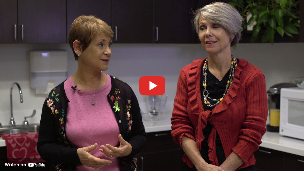 Dieticians discussing the benefits of healthy food and eating.