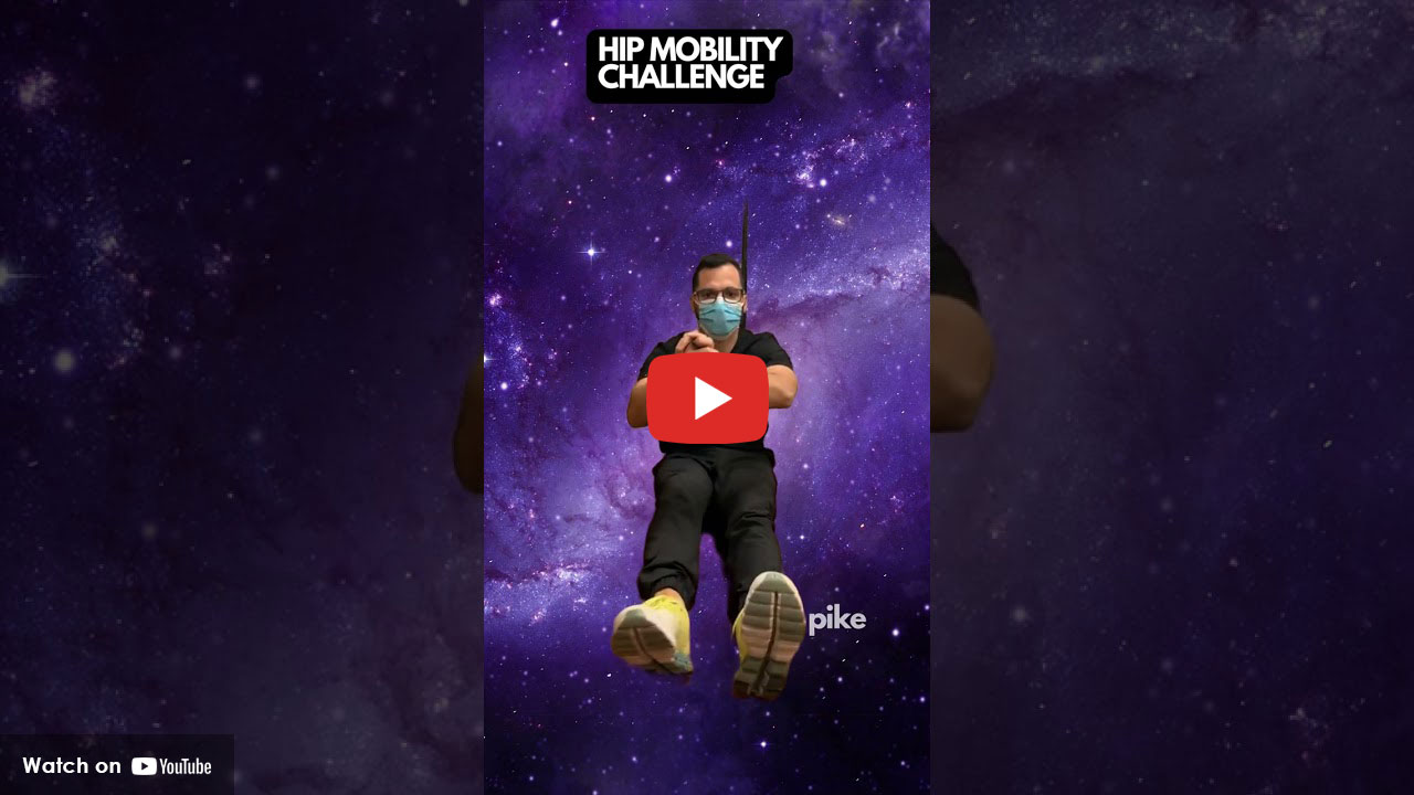 Physical therapist demonstrating seated hip mobility exercise